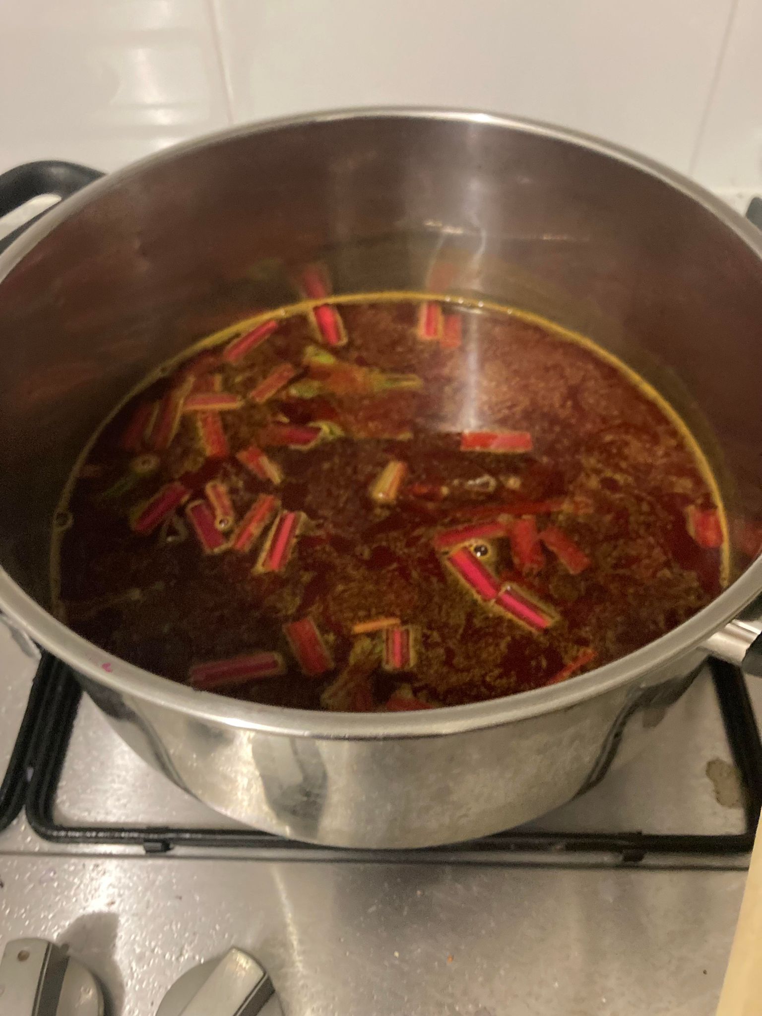 A pot of red liquid dye and pieces of beetroot step.